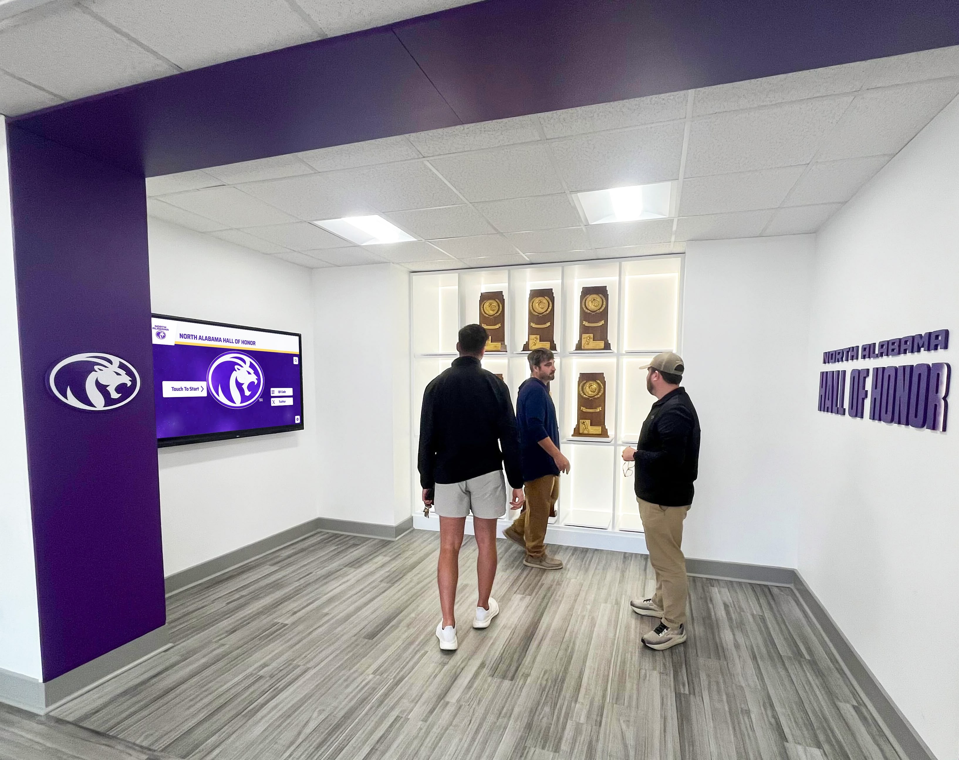 Community members viewing recognition displays Award ceremony recognition